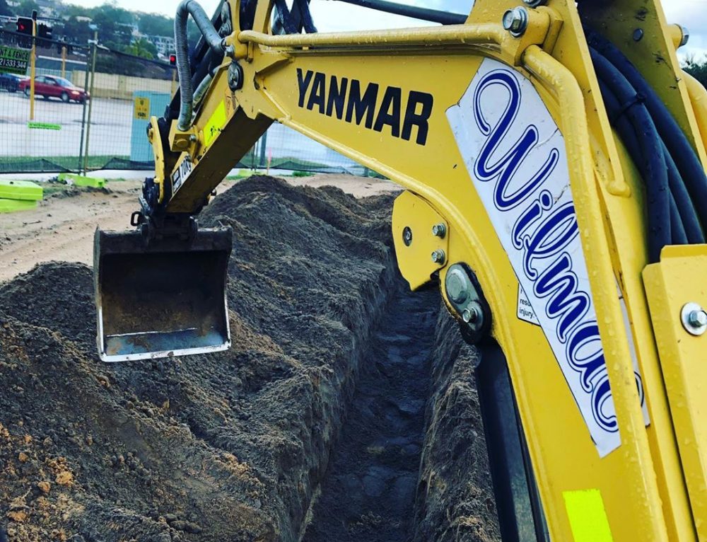 Out on site digging water and gas mains for a set of 3 units